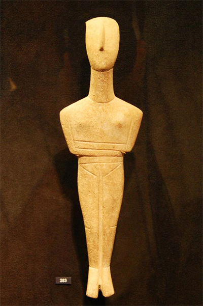 Stylized figurine with arms crossed